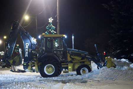 It took a bulldozer to remove all the snow from this street.  I had to sit in my car and wait until he was done.