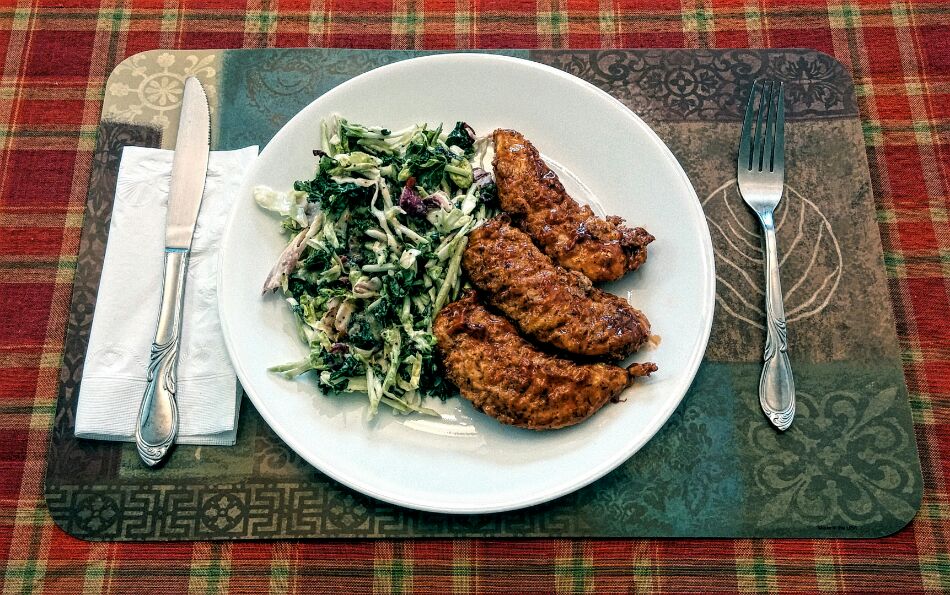 Spicey honey soy glazed chicken tenders with kale cranberry sauce.